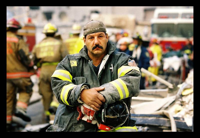 Turnley color photograph of a firefighter in the aftermath of 9/11/2001.